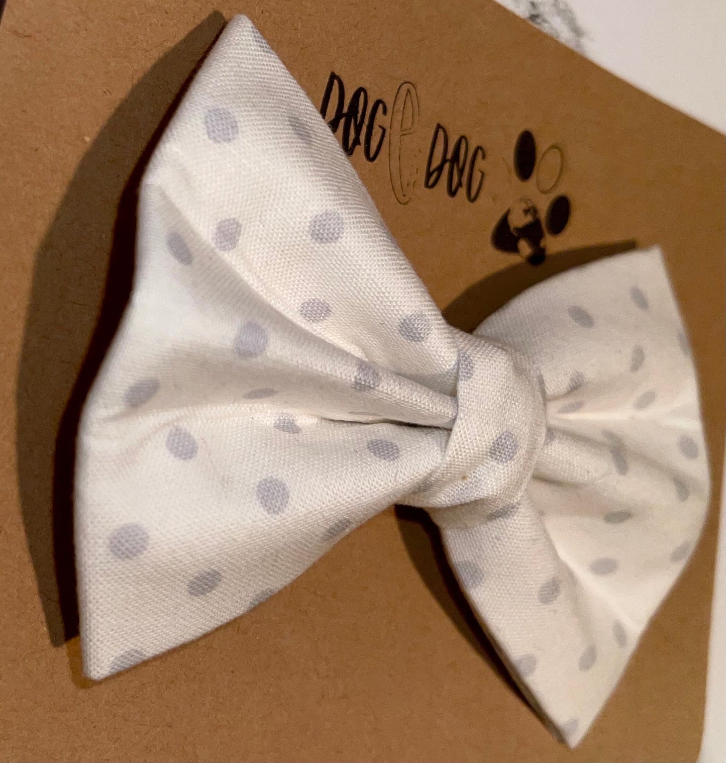 White with gray polka dots