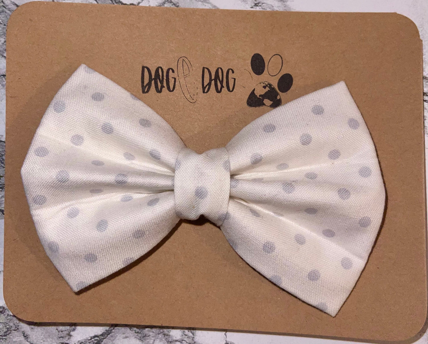 White with gray polka dots